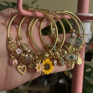 Gold Charm Bracelets with Floral and Eye Accents
